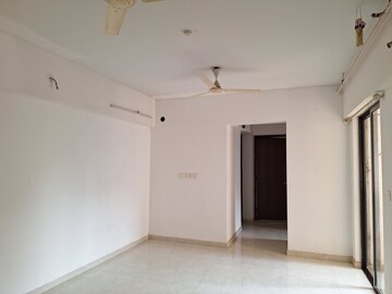 Living Room in 1 BHK Apartment at Lodha Lakeshore Greens, Dombivli East – for Rent