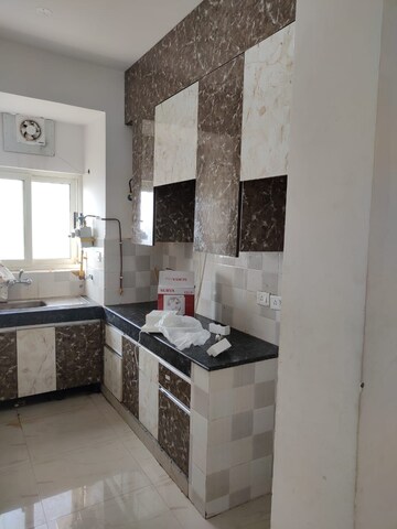 Kitchen in 2 BHK Apartment at Nimbus Express Park View, Chi V Greater Noida – for Rent