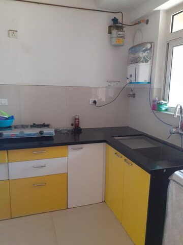 Kitchen in 3 BHK Apartment at Hiranandani Skylark Enclave, Ghodbunder Road – for Rent