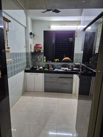 Kitchen in 1 BHK Apartment at Asha Park CHS, Dombivli East – for Sale
