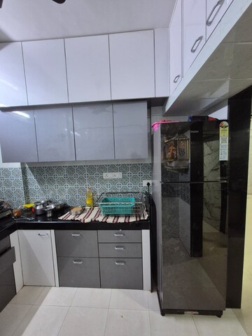 Kitchen in 1 BHK Apartment at Asha Park CHS, Dombivli East – for Sale