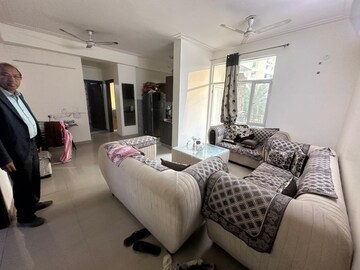 Living Room in 2.5 BHK Apartment at Mahagun Moderne, Sector 78 – for Rent
