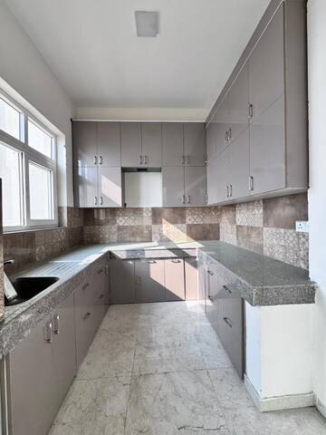 Kitchen in 4 BHK Apartment at BPTP Discovery Park, Sector 80 – for Rent