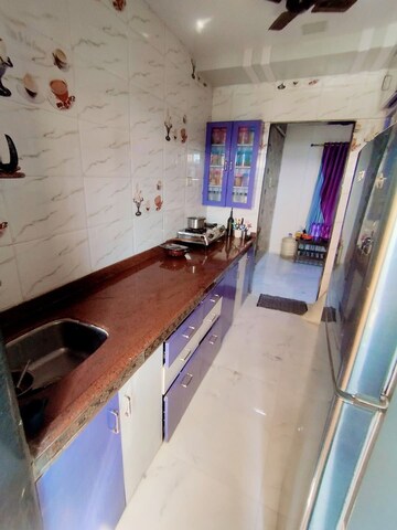 Kitchen in 2 BHK Apartment at Laxmi Dhule Complex, Nalasopara East – for Sale
