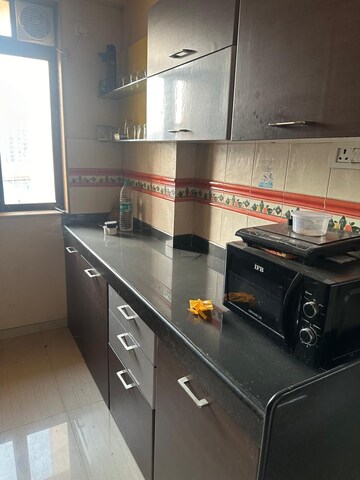 Kitchen in 2 BHK Apartment at Lodha Paradise, Majiwada – for Rent