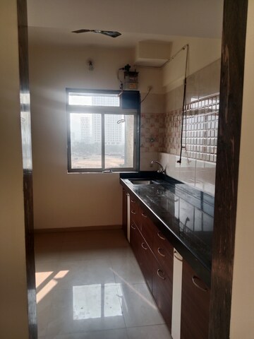 Kitchen in 2 BHK Apartment at Unnathi Woods Phase 1 And 2, Ghodbunder Road – for Rent