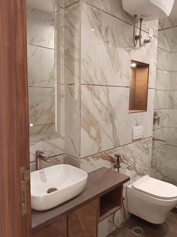 Bathroom in 4 BHK Builder Floor at Ansal Sushant Lok I, Sector 43 – for Rent