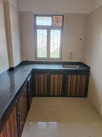 Kitchen in 2 BHK Apartment at Cosmos Classique, Ghodbunder Road – for Sale