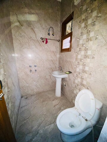 Bathroom in 2 BHK Apartment at Sunny Enclave – for Rent