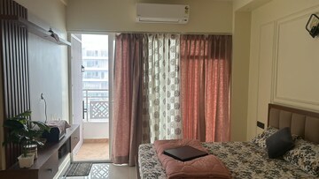 Living Room in Studio Apartment at Gaur City Center, Sector 4, Greater Noida – for Rent