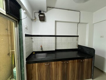 Kitchen in 2 BHK Apartment at Rosa Gardenia, Ghodbunder Road – for Rent