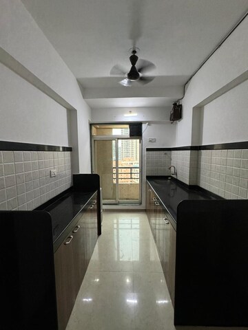 Kitchen in 2 BHK Apartment at Rosa Gardenia, Ghodbunder Road – for Rent