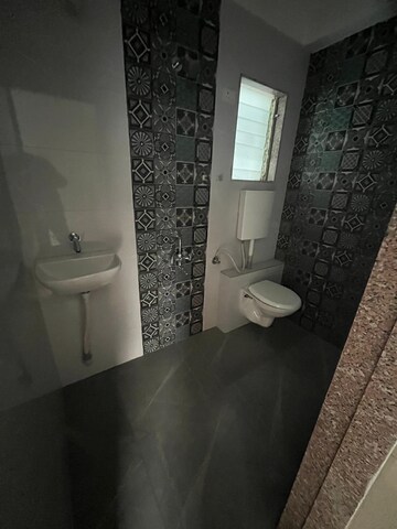 Bathroom in 1 BHK Apartment at Shreeji Landmark, Shirgaon – for Sale
