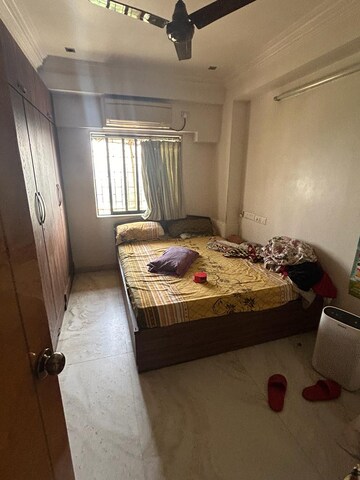 Bedroom in 2 BHK Apartment at Powai Cosmopolitan CHS, Powai – for Rent
