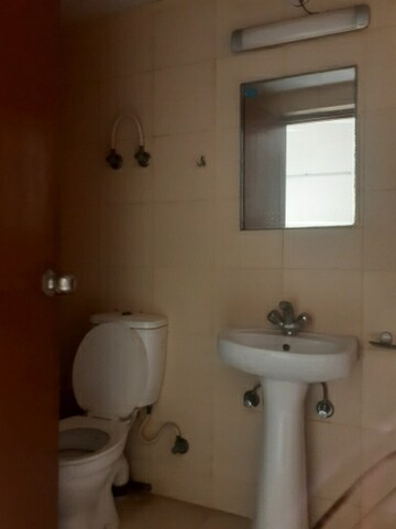 Bathroom in 3 BHK Apartment at Mahagun Mywoods, Sector 16c Greater Noida – for Rent