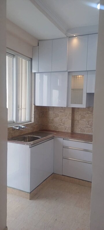 Kitchen in 3 BHK Apartment at Amrapali Golf Homes, Sector 4, Greater Noida – for Sale