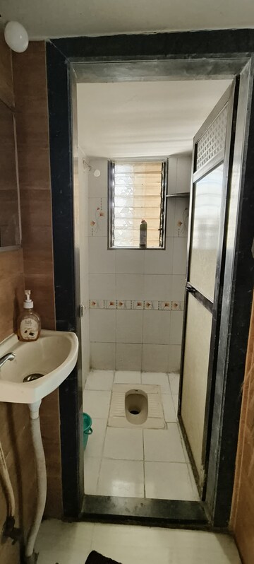 Bathroom in 2 BHK Apartment at Devi Shivamrut CHS, Thakurli – for Sale