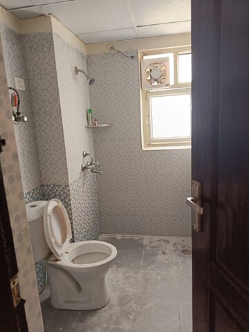 Bathroom in 2 BHK Apartment at Aims Golf City, Sector 75 – for Rent