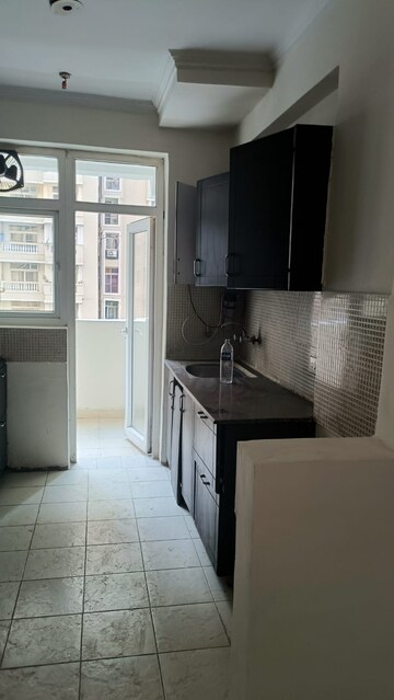 Kitchen in 3 BHK Apartment at Amrapali Silicon City, Sector 76 – for Rent