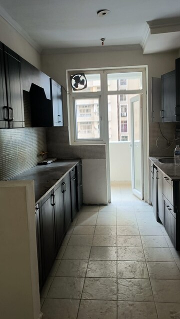 Kitchen in 3 BHK Apartment at Amrapali Silicon City, Sector 76 – for Rent
