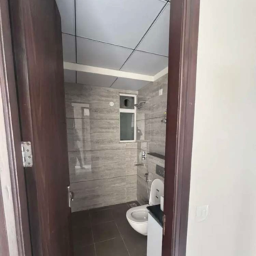 Bathroom in 3 BHK Apartment at Aura Gazania, High Ground – for Rent