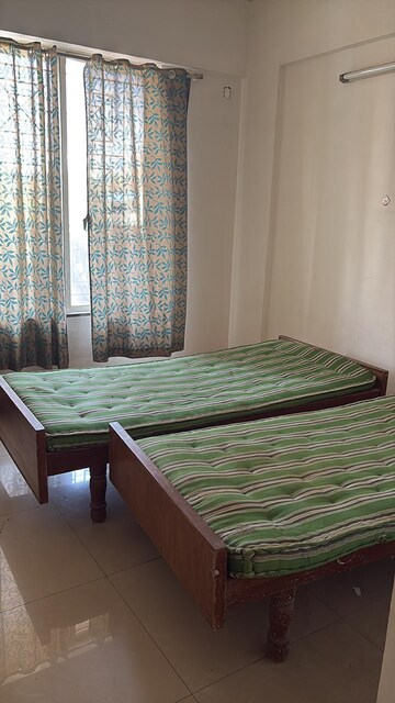Bedroom in 2 BHK Apartment at Eisha Varsha, Vikas Nagar – for Rent