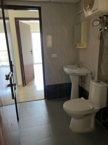 Bathroom in 3 BHK Apartment at Mahagun Mywoods II, Sector 16c Greater Noida – for Rent