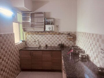 Kitchen in 2 BHK Apartment at Gaur City 2 - 12th Avenue, Sector 16c Greater Noida – for Rent