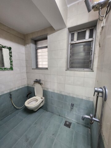 Bathroom in 3 BHK Apartment at Soham Garden, Manpada – for Rent