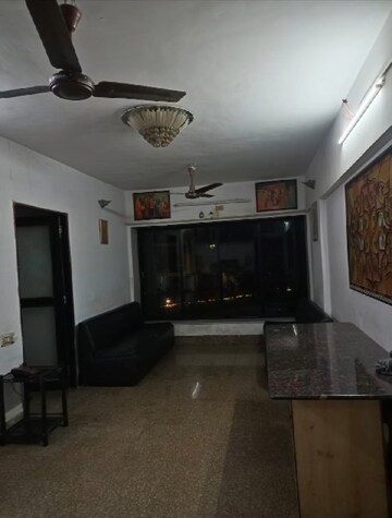 Living Room in 2 BHK Apartment at Ascot CHS, Andheri West – for Rent