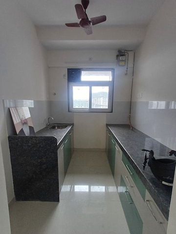 Kitchen in 2 BHK Apartment at Ashar16, Wagle Industrial Estate – for Rent