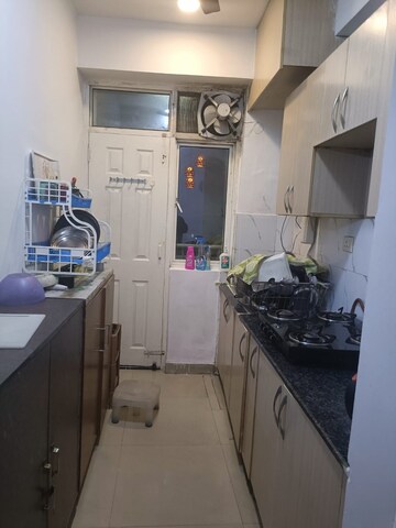 Kitchen in 2 BHK Apartment at Amrapali Silicon City, Sector 76 – for Rent