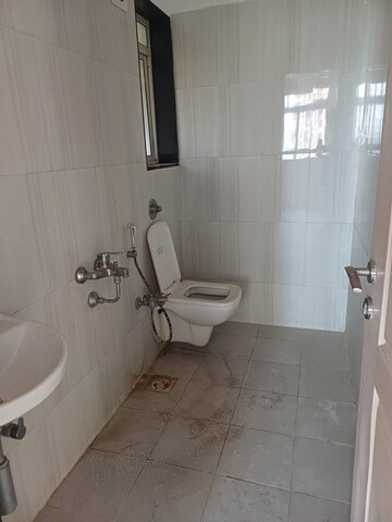 Bathroom in 1 BHK Apartment at Puranik City, Kasarvadavali – for Rent