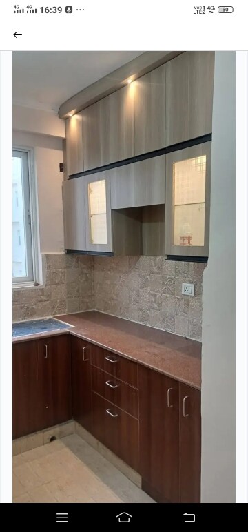 Kitchen in 2 BHK Apartment at Mahagun Mywoods, Sector 16c Greater Noida – for Rent
