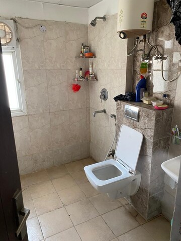 Bathroom in 2 BHK Apartment at Aims Golf City, Sector 75 – for Rent