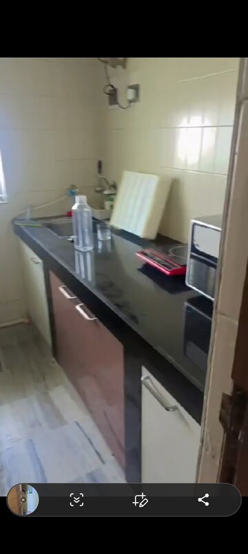 Kitchen in 1 BHK Apartment at Ashirwad CHS Andheri West, Versova – for Rent