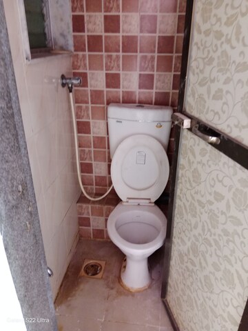 Bathroom in 1 BHK Apartment at Om Kalyani CHS, Dahisar West – for Rent