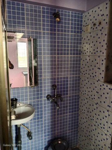 Bathroom in 1 BHK Apartment at Om Kalyani CHS, Dahisar West – for Rent
