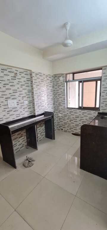 Kitchen in 1.5 BHK Apartment at Alamdar Al-Fatema Heights, Dongri – for Rent