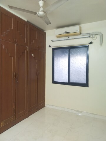 Bedroom in 2 BHK Apartment at Naiknavare Gardenia Society Phase 1, Wadgaon Sheri – for Rent