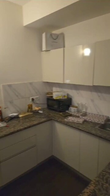 Kitchen in 1 RK Apartment at Sunworld Arista, Sector 168 – for Rent