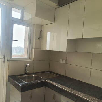 Kitchen in 2 BHK Apartment at Tata Eureka Park, Sector 150 – for Rent