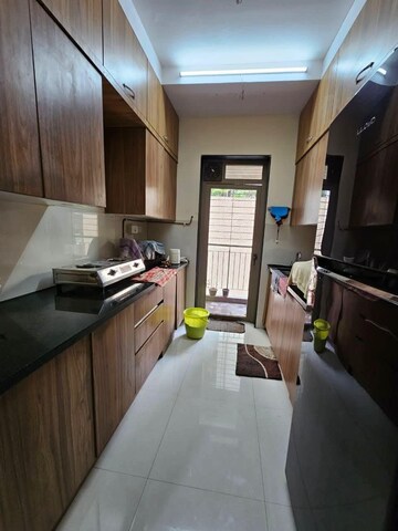Kitchen in 2 BHK Apartment at Lodha Splendora River View, Ghodbunder Road – for Sale