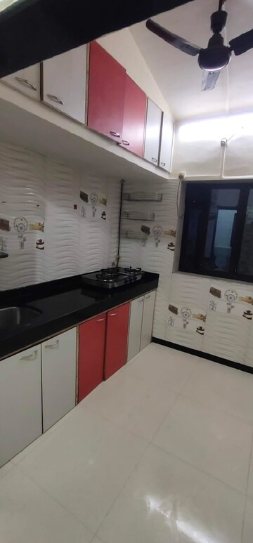 Kitchen in 1 BHK Apartment at Dayanand CHS, Aarey Colony – for Rent