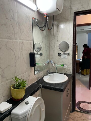 Bathroom in 3 BHK Apartment at Mahagun Mirabella, Sector 79 – for Rent