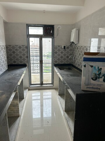Kitchen in 2 BHK Apartment at Sanghvi Ecocity Woods, Mahajanwadi – for Sale