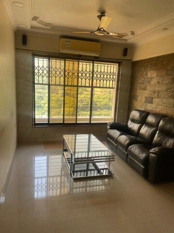 Living Room in 2 BHK Apartment at Nilgiri Upvan CHS, Gawand Baug – for Rent