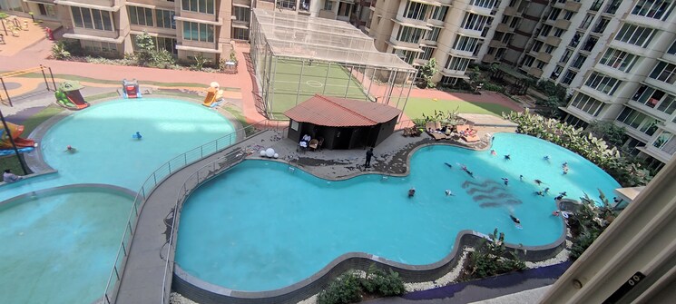 Swimming Pool, marathon-nexzone-atlas-1 2 Bedroom 627 Sq.Ft. Apartment In New Panvel Navi Mumbai 8120584