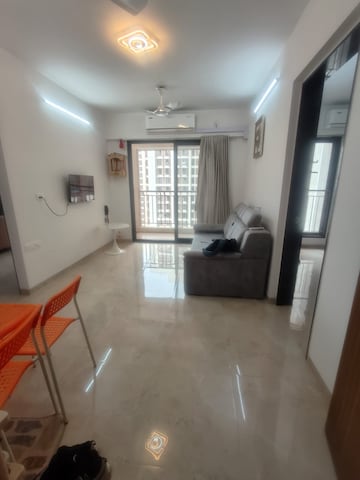 Living Room in 1 BHK Apartment at MICL Aaradhya Parkwood, Mira Road – for Sale