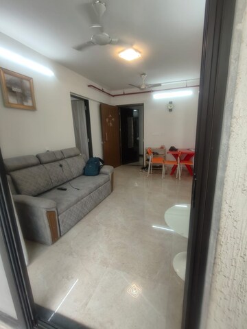 Living Room in 1 BHK Apartment at MICL Aaradhya Parkwood, Mira Road – for Sale